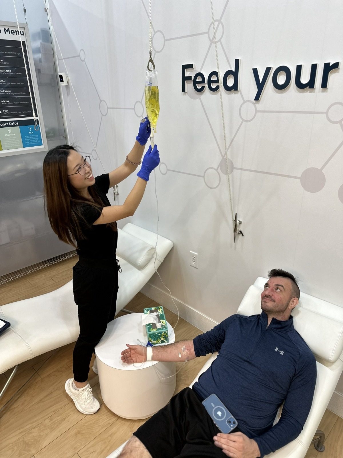 Guest relaxing during an IV drip